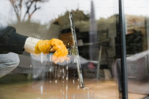 washing window with squeegee